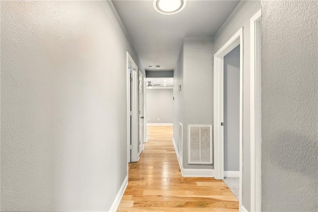 1900 Woods Dr, Metairie, LA 70001 - hall featuring light wood-style floors and baseboards
