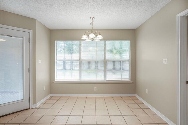 1556 Cherry St, Slidell, LA 70460 - unfurnished dining area featuring a chandelier and a textured ceiling