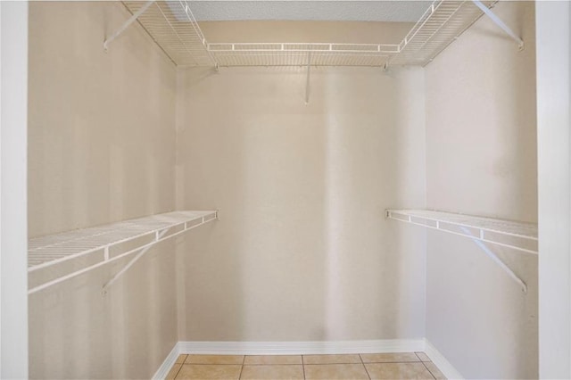 1556 Cherry St, Slidell, LA 70460 - walk in closet with light tile patterned floors