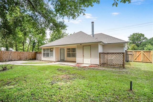 1556 Cherry St, Slidell, LA 70460 - back of house featuring roof with shingles, a patio, and a gate