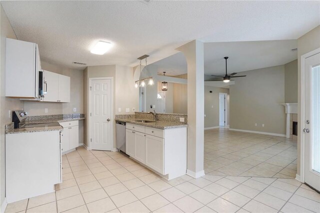 1556 Cherry St, Slidell, LA 70460 - kitchen featuring appliances with stainless steel finishes, a sink, a ceiling fan, light tile patterned floors, and white cabinetry