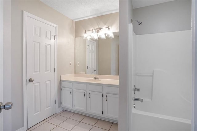 1556 Cherry St, Slidell, LA 70460 - bathroom with vanity, bathtub / shower combination, tile patterned flooring, and a textured ceiling