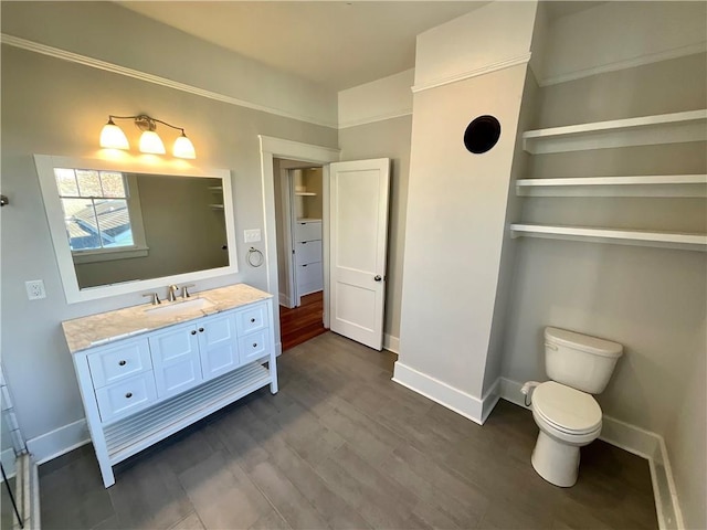 402527 Constance St, New Orleans, LA 70115 - bathroom featuring vanity, baseboards, wood finished floors, and toilet