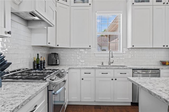 421 Tiger Ave, Covington, LA 70433 - kitchen with a sink, stainless steel appliances, white cabinets, and glass insert cabinets
