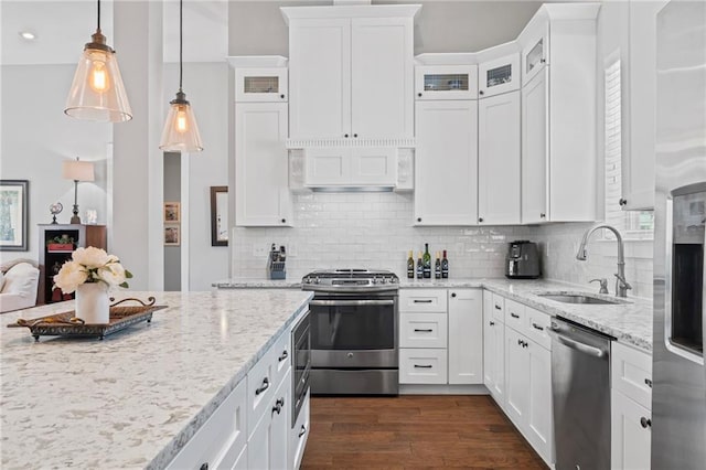 421 Tiger Ave, Covington, LA 70433 - kitchen featuring stainless steel appliances, a sink, white cabinets, and recessed lighting