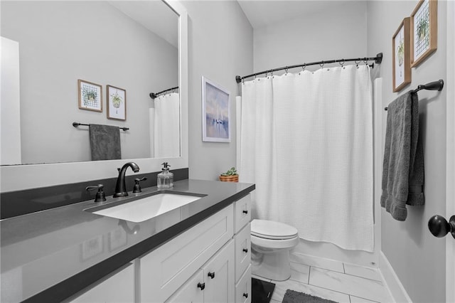 421 Tiger Ave, Covington, LA 70433 - bathroom with marble look tile flooring, vanity, toilet, shower / bath combo, and baseboards
