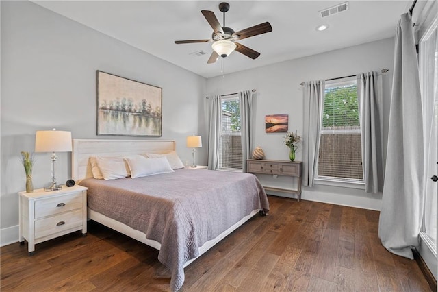 421 Tiger Ave, Covington, LA 70433 - bedroom with multiple windows, dark wood finished floors, ceiling fan, and recessed lighting