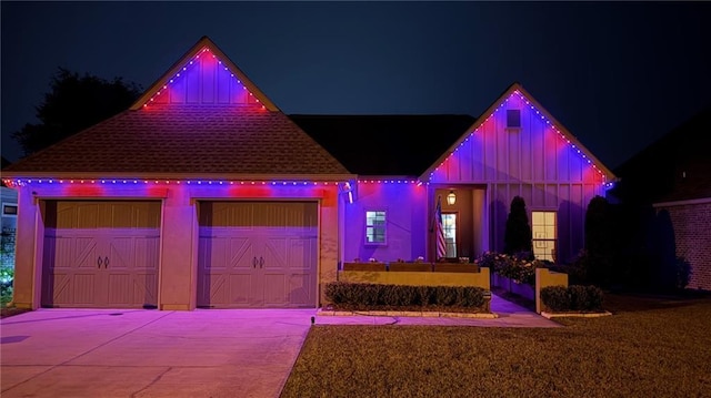 421 Tiger Ave, Covington, LA 70433 - view of front facade featuring board and batten siding, driveway, and a shingled roof