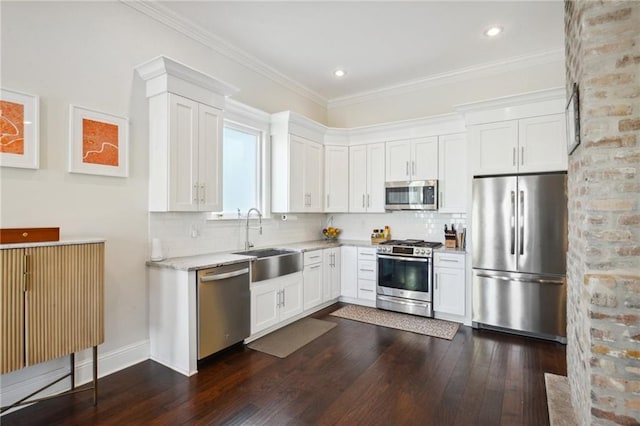 8236 S Claiborne Ave, New Orleans, LA 70118 - kitchen featuring stainless steel appliances, a sink, dark wood-style flooring, backsplash, and ornamental molding