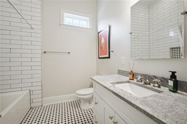 8236 S Claiborne Ave, New Orleans, LA 70118 - full bathroom with vanity, toilet, baseboards, and  shower combination