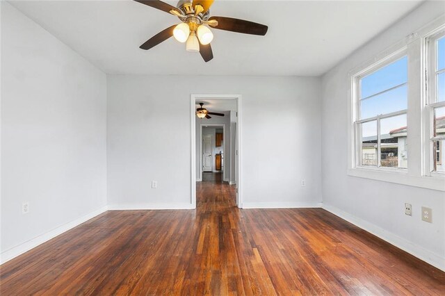 220002 Delille St, Chalmette, LA 70043 - empty room featuring hardwood / wood-style floors, ceiling fan, and baseboards