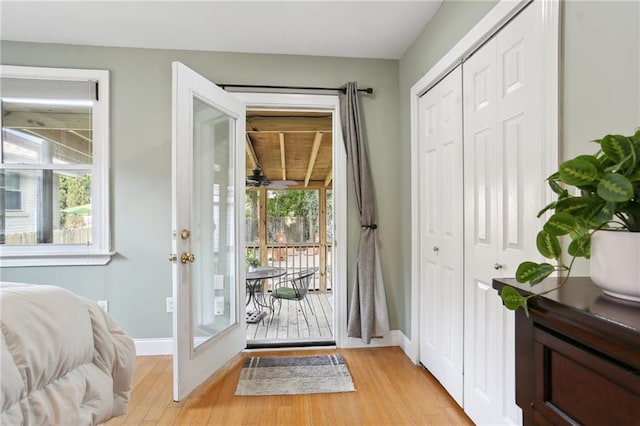 6550 General Diaz St, New Orleans, LA 70124 - doorway featuring plenty of natural light, light wood-style flooring, and baseboards