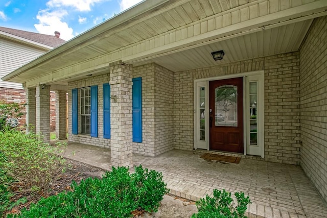 1550 De Battista Pl, New Orleans, LA 70131 - view of exterior entry with a porch and brick siding