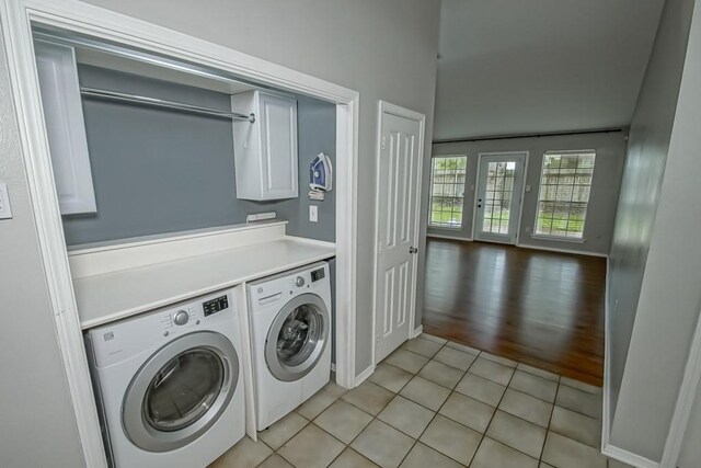 1550 De Battista Pl, New Orleans, LA 70131 - laundry area featuring washer and dryer and light tile patterned flooring