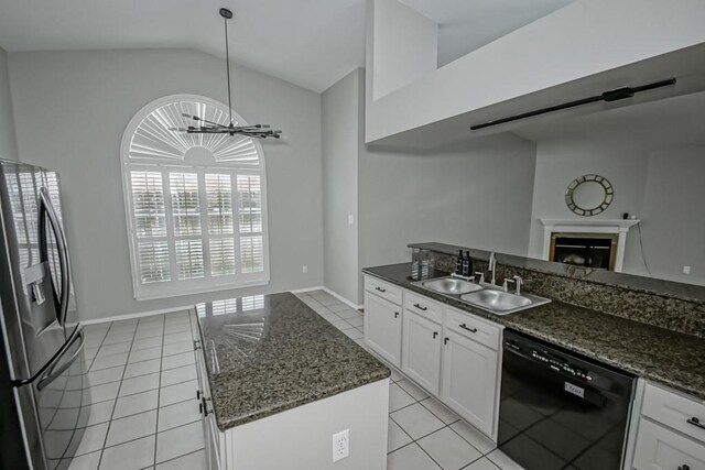 1550 De Battista Pl, New Orleans, LA 70131 - kitchen with dishwasher, refrigerator with ice dispenser, a sink, light tile patterned floors, and lofted ceiling