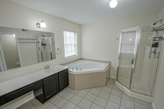 1550 De Battista Pl, New Orleans, LA 70131 - bathroom with a shower stall, tile patterned floors, a garden tub, vanity, and toilet