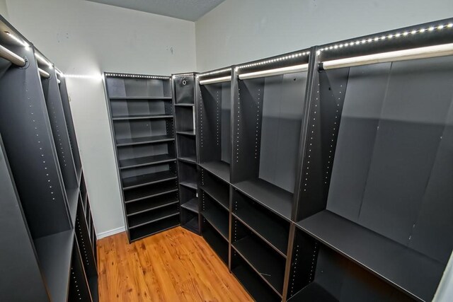 1550 De Battista Pl, New Orleans, LA 70131 - spacious closet with wood finished floors