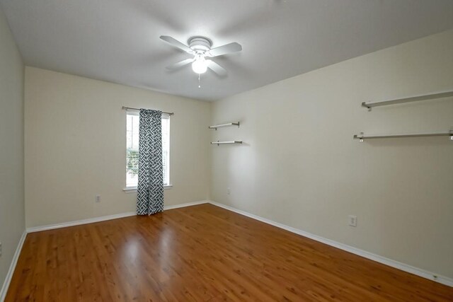 1550 De Battista Pl, New Orleans, LA 70131 - spare room with ceiling fan, wood finished floors, and baseboards
