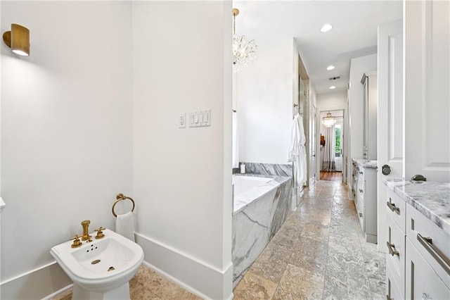 2538 N Rampart St, New Orleans, LA 70117 - bathroom with a bidet, vanity, a bath, and recessed lighting