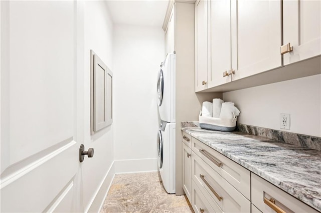 2538 N Rampart St, New Orleans, LA 70117 - washroom featuring cabinet space and estacked washer and dryer