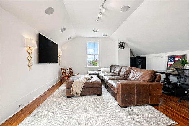 2538 N Rampart St, New Orleans, LA 70117 - living area with wood finished floors, track lighting, and lofted ceiling