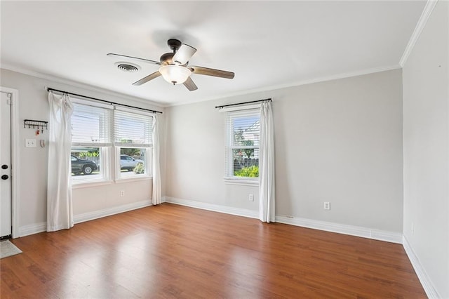 725 N Turnbull Dr, Metairie, LA 70001 - spare room with crown molding, wood finished floors, a ceiling fan, and baseboards