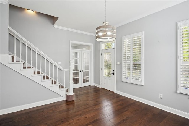 5830 Marshal Foch St, New Orleans, LA 70124 - foyer entrance with wood-type flooring, ornamental molding, french doors, a chandelier, and stairway