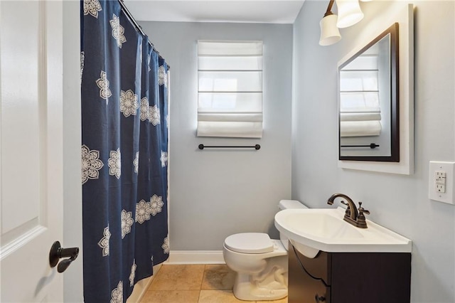 5830 Marshal Foch St, New Orleans, LA 70124 - bathroom featuring vanity, toilet, tile patterned flooring, baseboards, and a shower with curtain