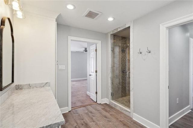 5830 Marshal Foch St, New Orleans, LA 70124 - full bathroom featuring a shower stall, recessed lighting, wood finished floors, baseboards, and a ceiling fan