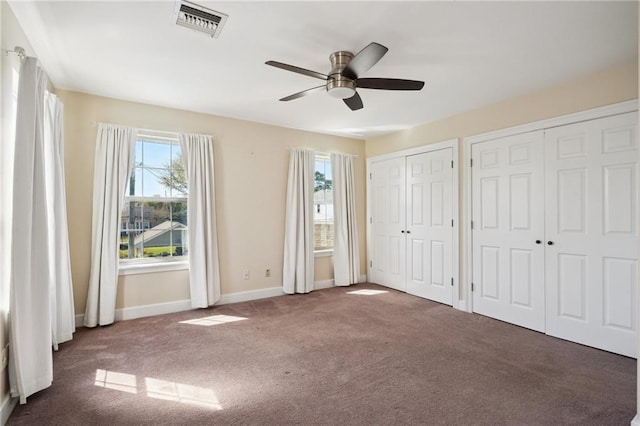 5830 Marshal Foch St, New Orleans, LA 70124 - unfurnished bedroom featuring carpet, two closets, baseboards, and a ceiling fan
