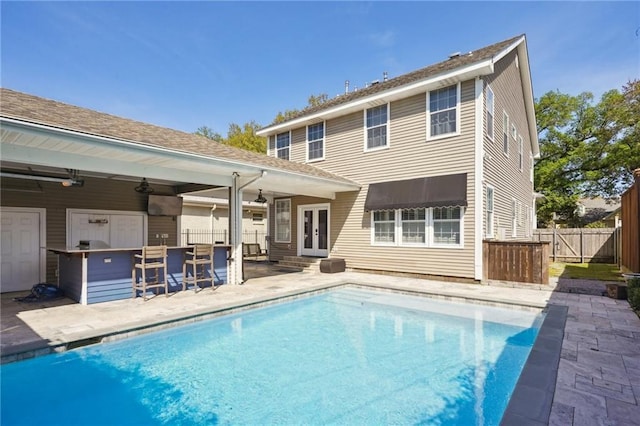 5830 Marshal Foch St, New Orleans, LA 70124 - back of property with french doors, a patio area, a ceiling fan, and roof with shingles