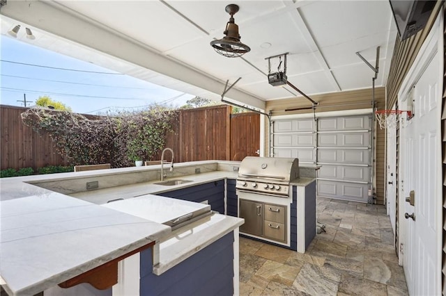 5830 Marshal Foch St, New Orleans, LA 70124 - garage with a sink, a ceiling fan, and a garage door opener