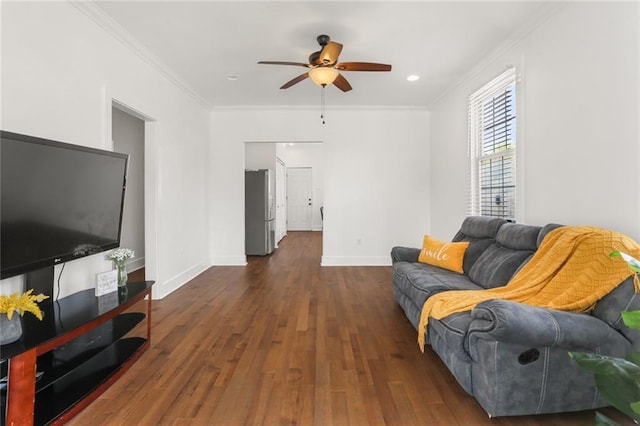 5124 Painters St, New Orleans, LA 70122 - living room featuring ceiling fan, dark wood-style flooring, crown molding, and baseboards