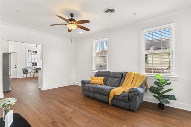 5124 Painters St, New Orleans, LA 70122 - sitting room with crown molding, a ceiling fan, wood finished floors, and baseboards
