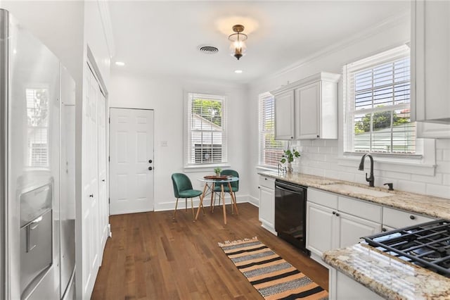 5124 Painters St, New Orleans, LA 70122 - kitchen featuring dishwasher, a sink, white fridge with ice dispenser, dark wood-style floors, and white cabinets