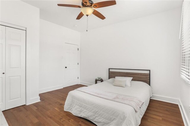 5124 Painters St, New Orleans, LA 70122 - bedroom with wood finished floors, baseboards, and a closet