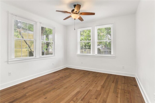 5124 Painters St, New Orleans, LA 70122 - unfurnished room with wood finished floors, a ceiling fan, and baseboards