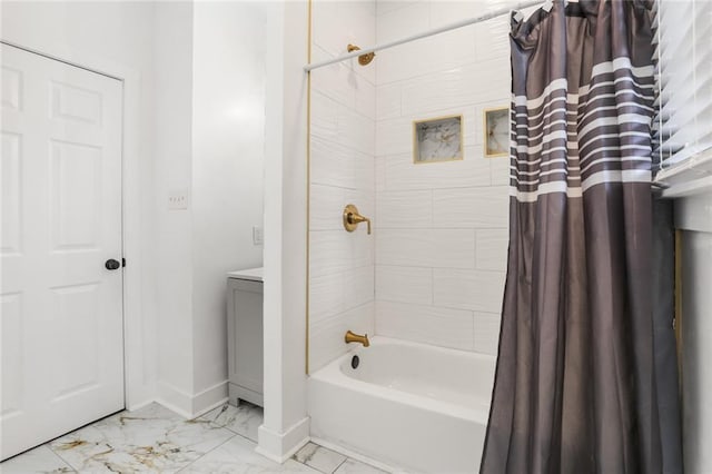 5124 Painters St, New Orleans, LA 70122 - full bath with marble finish floors, baseboards, and shower / bath combo