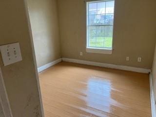 8830 Stroelitz St, New Orleans, LA 70118 - empty room with baseboards and wood finished floors