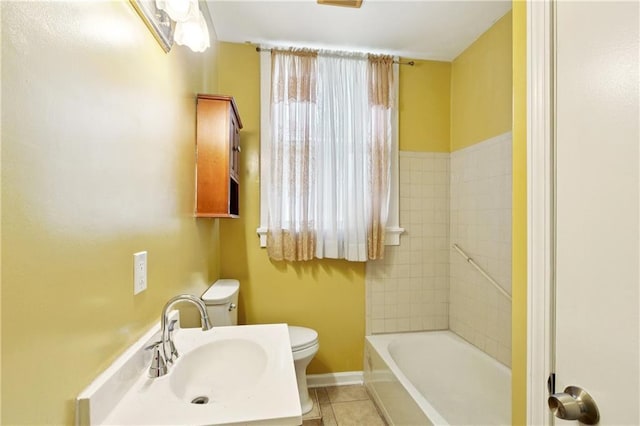 3717 S Johnson St, New Orleans, LA 70125 - bathroom with toilet, a sink, and tile patterned flooring