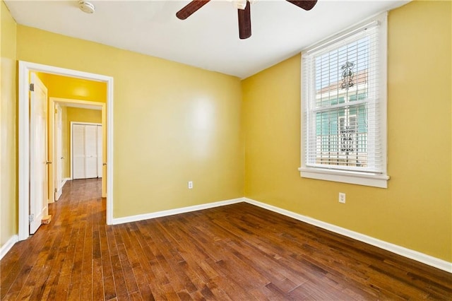 3717 S Johnson St, New Orleans, LA 70125 - unfurnished room featuring dark wood-style floors, ceiling fan, and baseboards