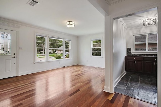 553 Crystal St, New Orleans, LA 70124 - foyer entrance with ornamental molding and dark wood-type flooring