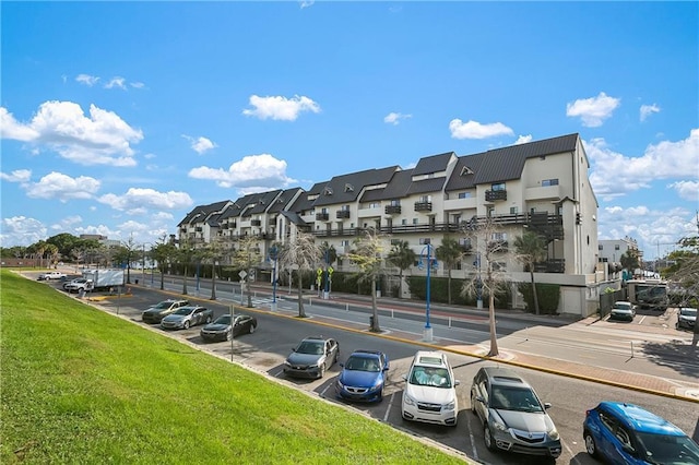 7300 Lakeshore Dr Unit 4, New Orleans, LA 70124 - view of property with uncovered parking and a residential view