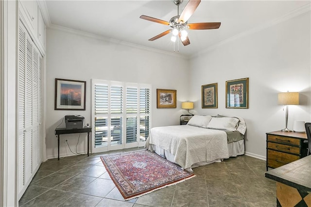 7300 Lakeshore Dr Unit 4, New Orleans, LA 70124 - bedroom featuring ornamental molding, baseboards, a closet, a ceiling fan, and tile patterned flooring