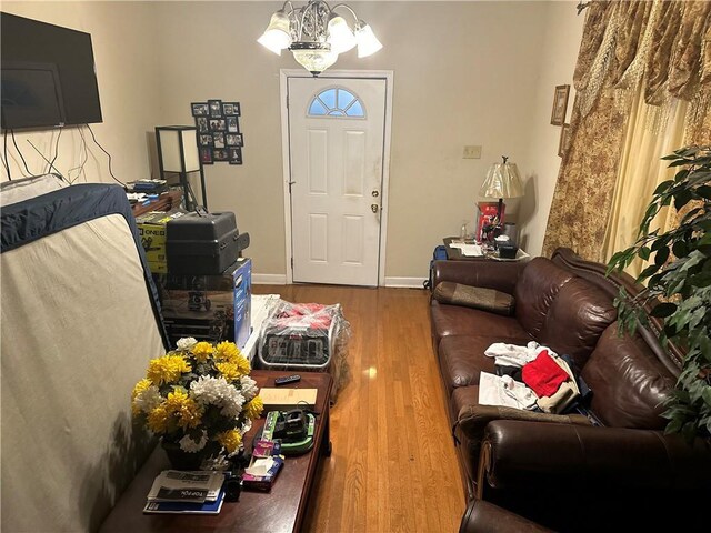 3526 Louisiana Ave Parkway, New Orleans, LA 70125 - foyer featuring a chandelier, wood finished floors, and baseboards