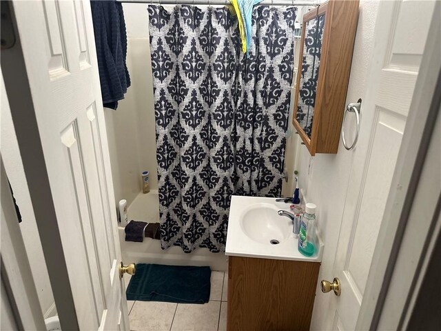 3526 Louisiana Ave Parkway, New Orleans, LA 70125 - bathroom featuring tile patterned floors, vanity, and shower / bath combination with curtain