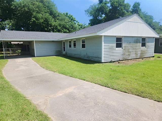 131 Celia Dr, Luling, LA 70070 - single story home with driveway, a front yard, an attached carport, and roof with shingles