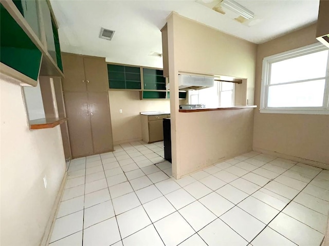 131 Celia Dr, Luling, LA 70070 - kitchen with light tile patterned flooring