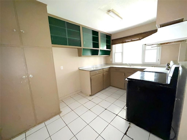 131 Celia Dr, Luling, LA 70070 - kitchen featuring range, open shelves, and light tile patterned floors