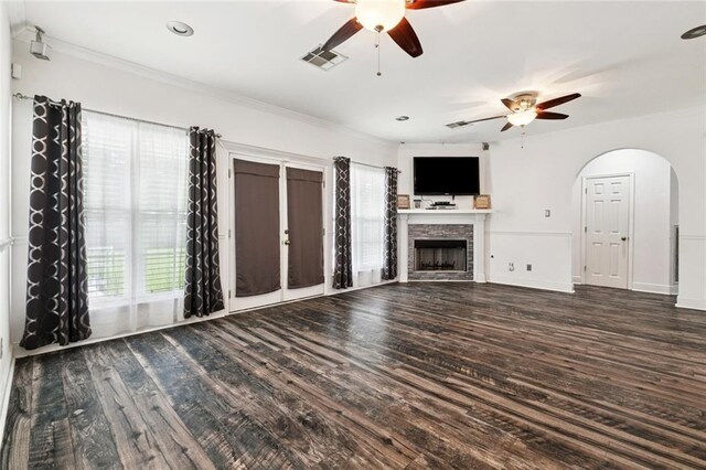 140 E Lakeview Dr, La Place, LA 70068 - unfurnished living room featuring ceiling fan, ornamental molding, wood finished floors, arched walkways, and a fireplace